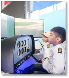 Young students using an aviation simulator