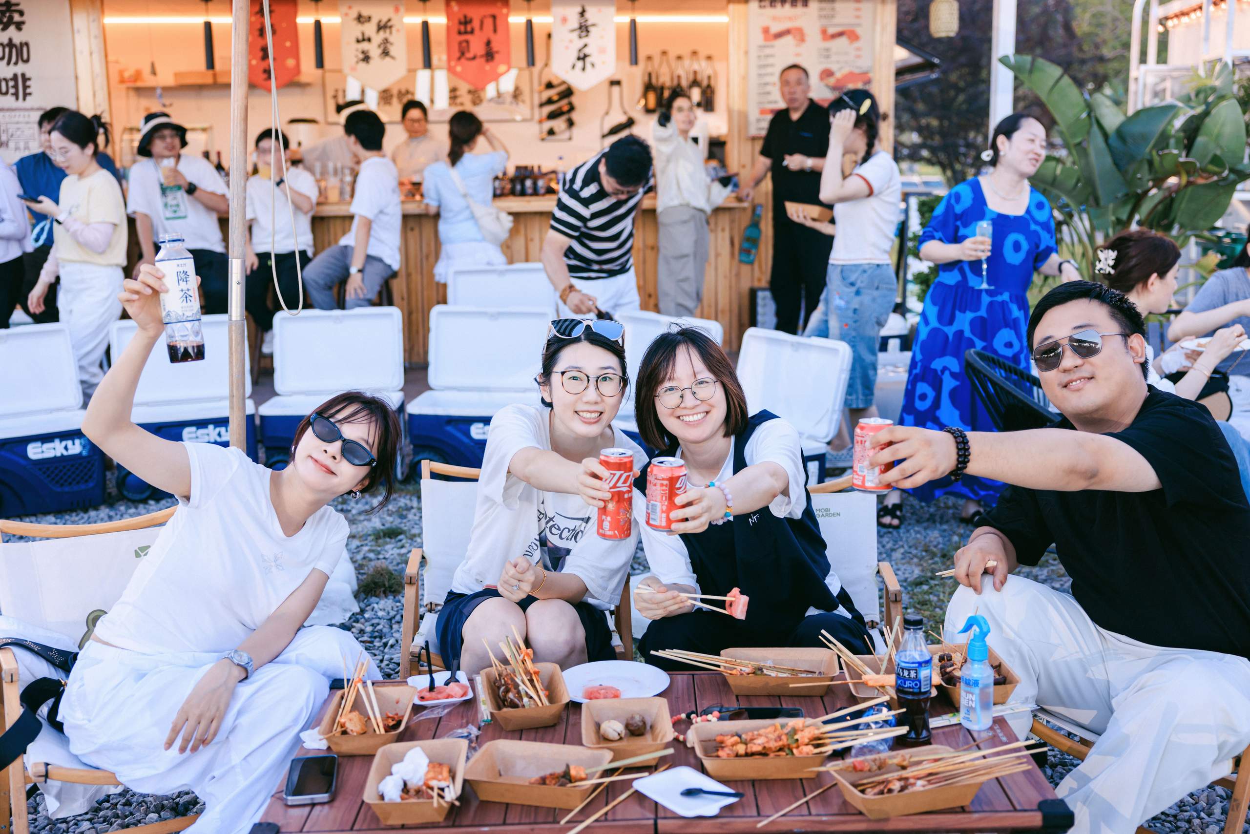 Friends enjoying an outdoor gathering at the aviation base