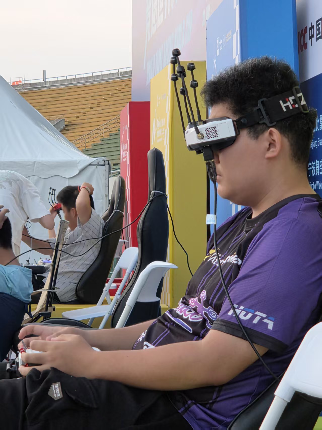 Young participant experiencing FPV drone racing